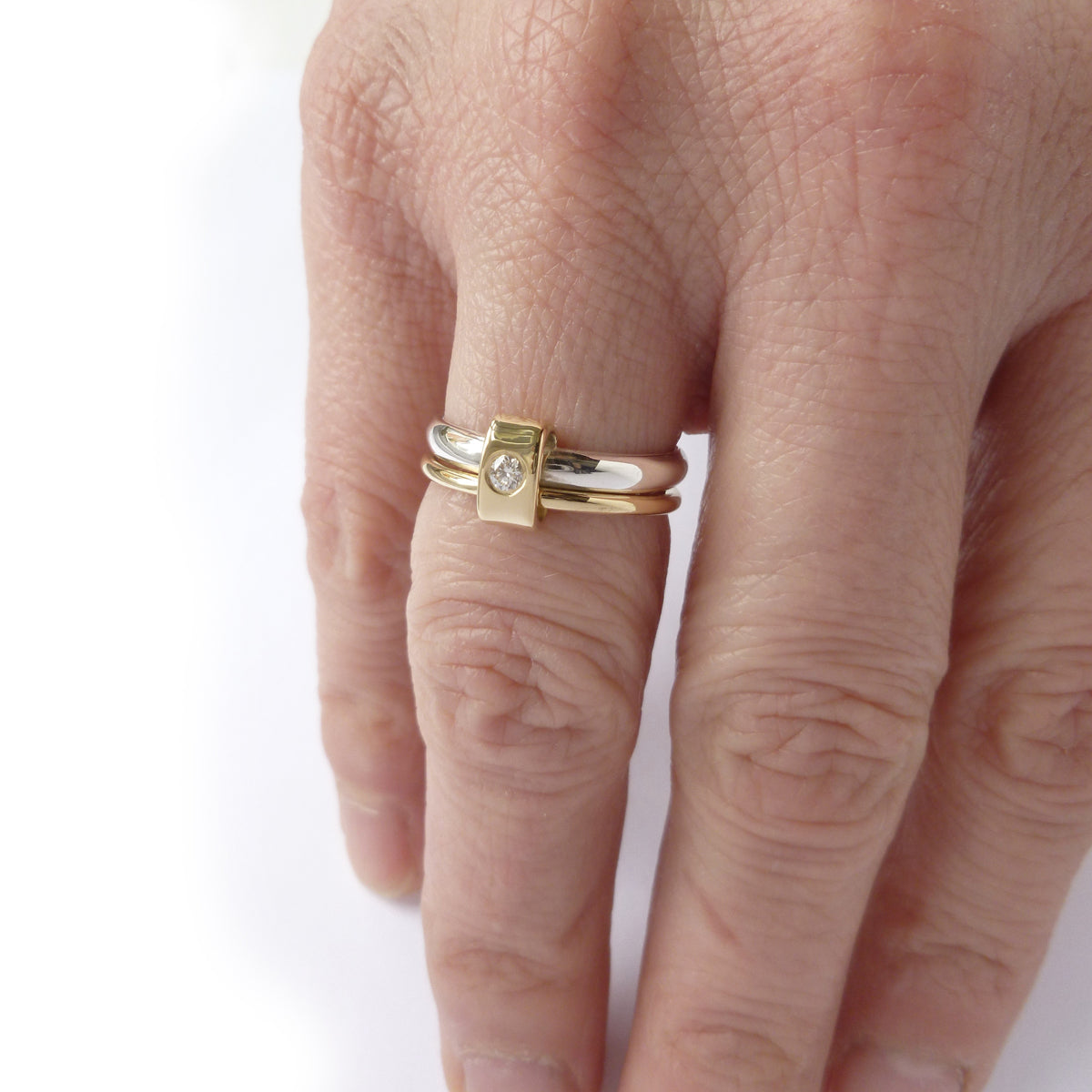Silver and 18ct yellow gold and diamond two band ring