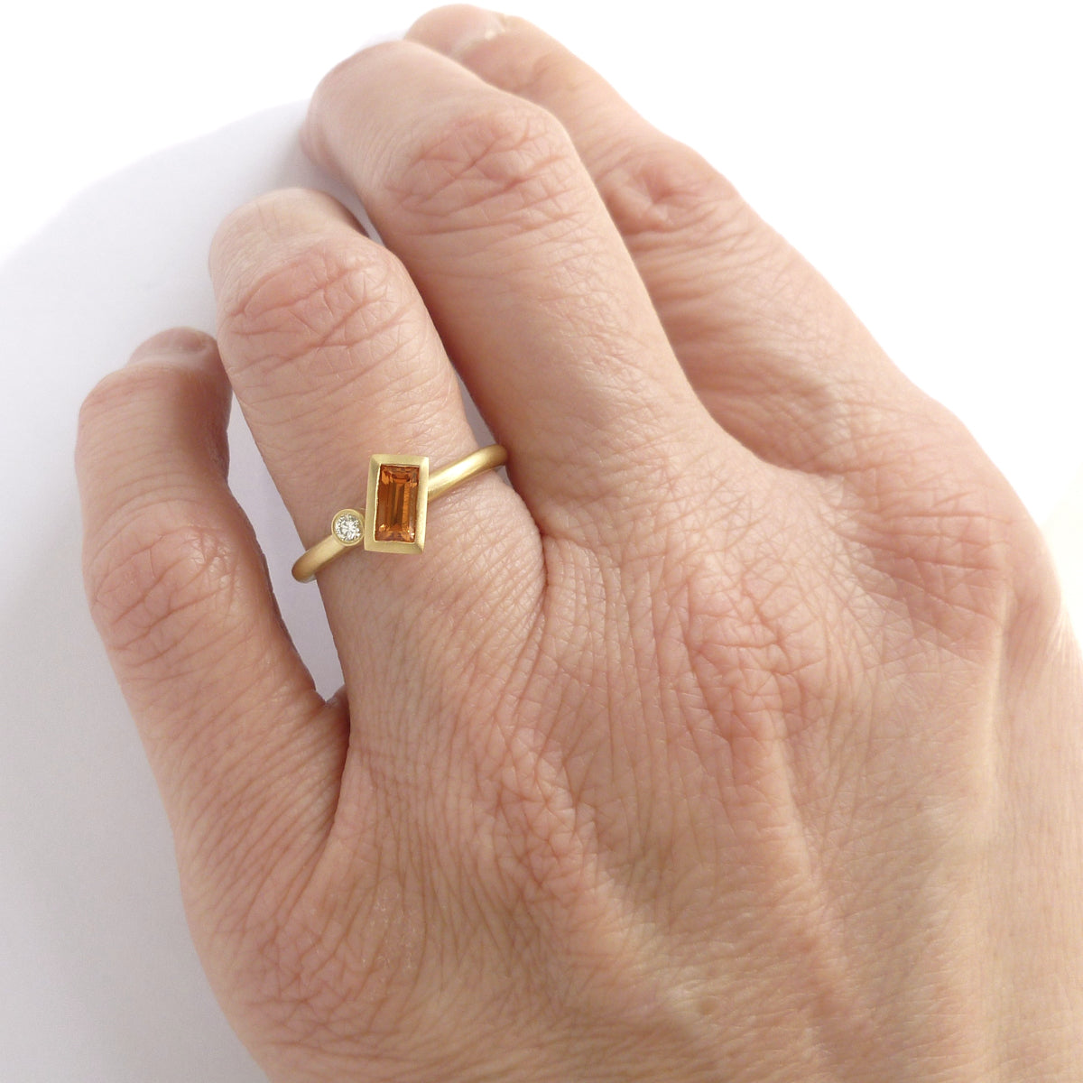 Contemporary jewellery, handmade, modern, bespoke gold and orange sapphire ring by Sue Lane