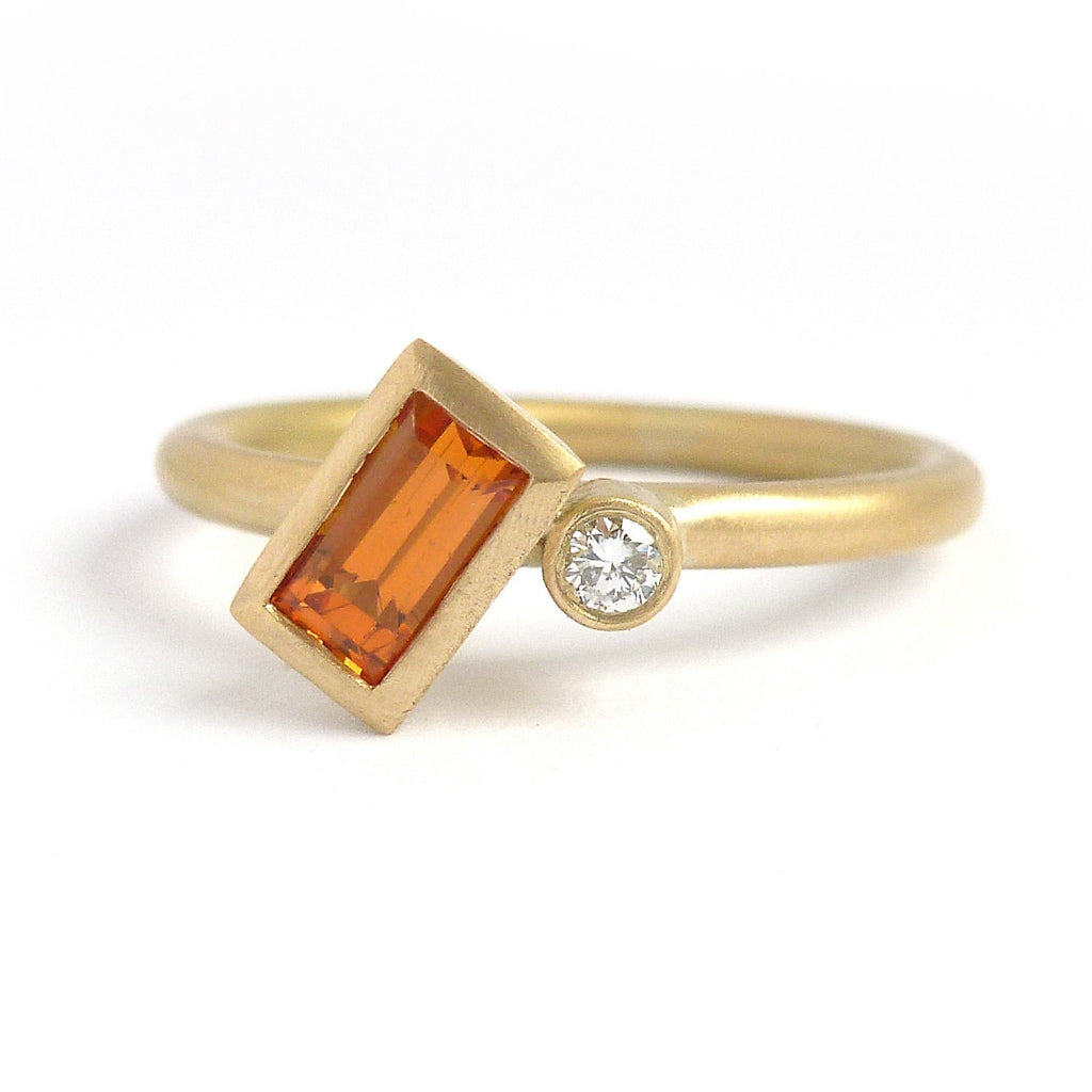 A bespoke orange sapphire and diamond 18ct gold ring. Contemporary and unique. 