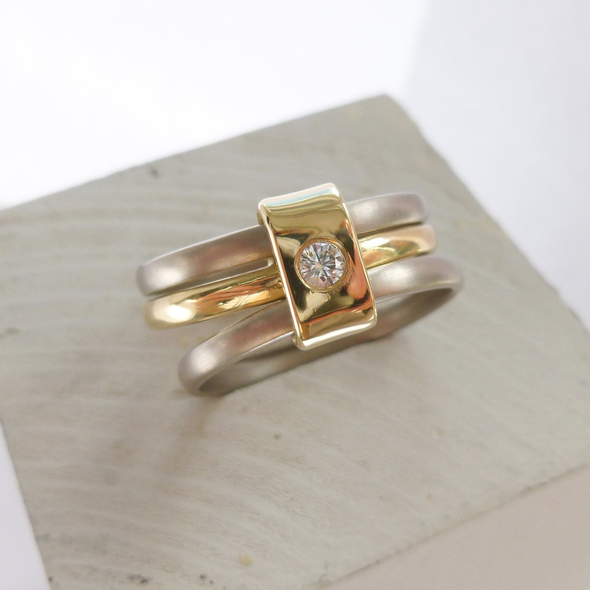 Contemporary jewellery, handmade, modern, bespoke ring by Sue Lane. Triple band ring, interlocking and linked.