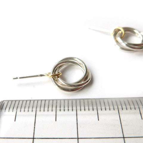 Contemporary, bespoke and modern silver and gold stud earrings with a matt brushed finish. Handmade by Sue Lane in Herefordshire, UK