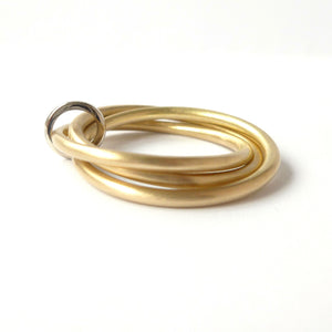 modern stacking twisted wedding ring in white and yellow gold