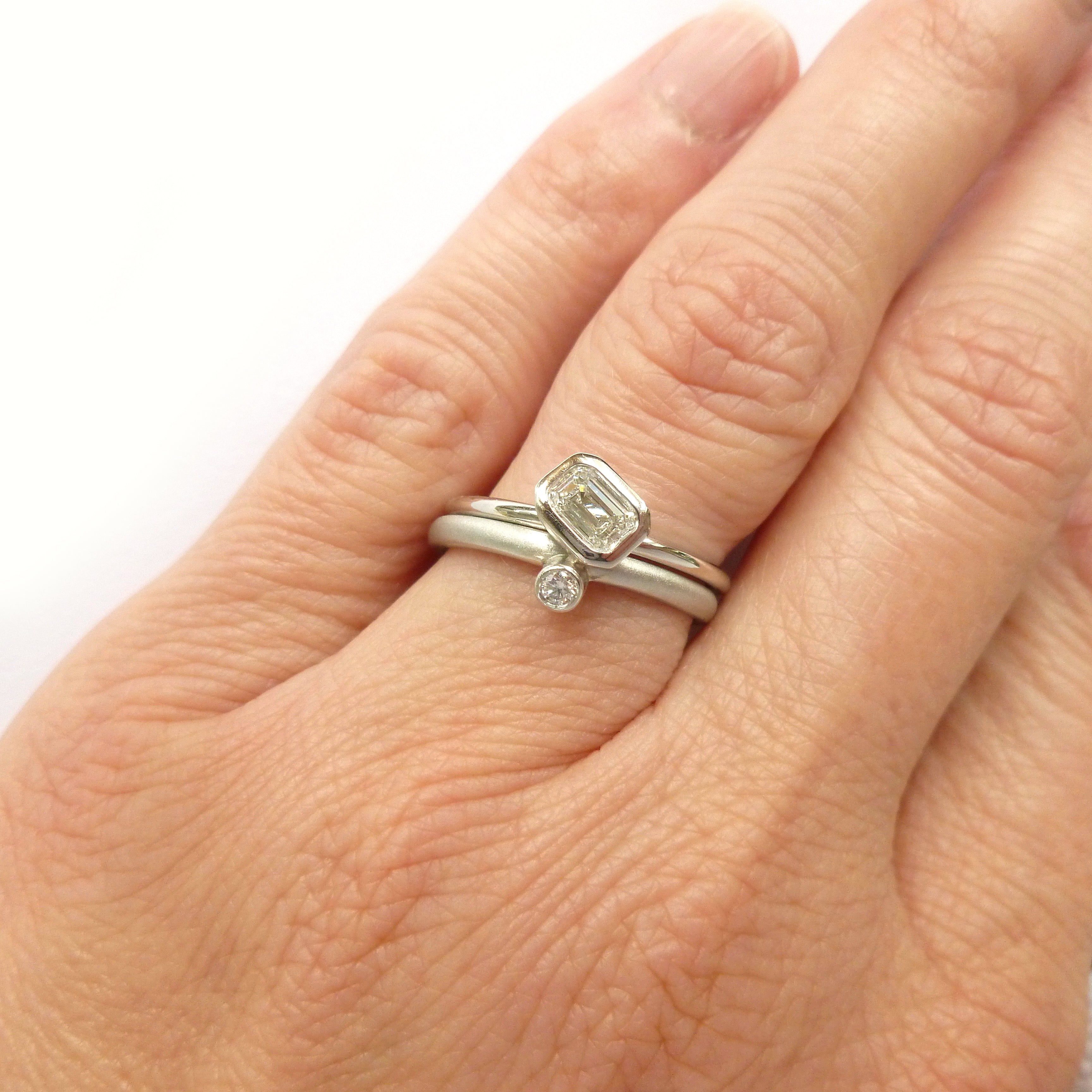 modern platinum and emerald cut diamond engagement and wedding ring handmade by Sue Lane