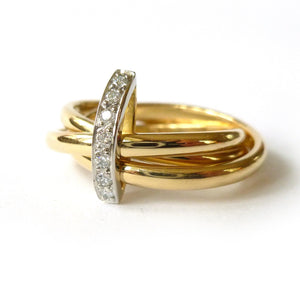 Modern russian ring style design in yellow gold and platinum with white diamonds pave set to join them 