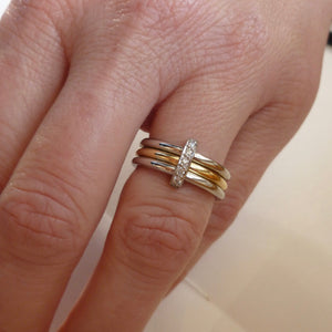 polished yellow gold and platinum modern eternity ring handmade in UK. Multi band ring or interlocking ring, sometimes called triple band rings too.