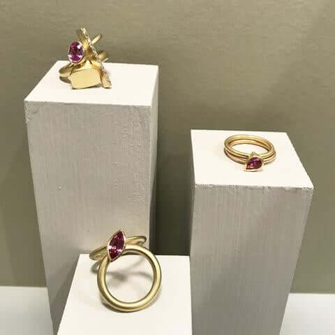 Contemporary engagement rings in gold with pink sapphires