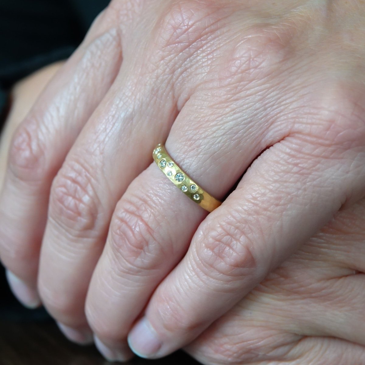 18ct gold diamond eternity ring with a hammered textured Sue Lane contemporary bespoke handmade