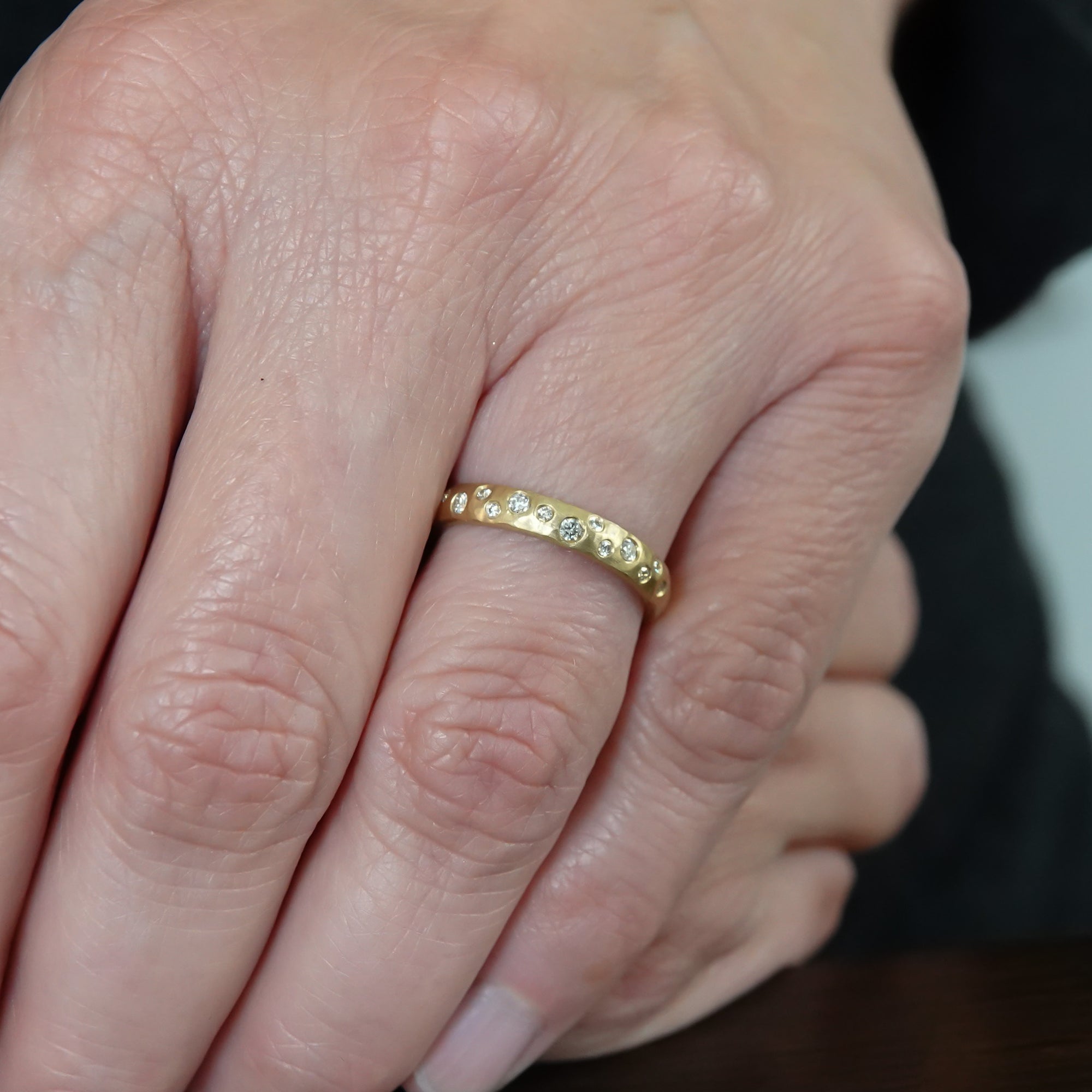 18ct gold diamond eternity ring with a hammered textured Sue Lane contemporary bespoke handmade
