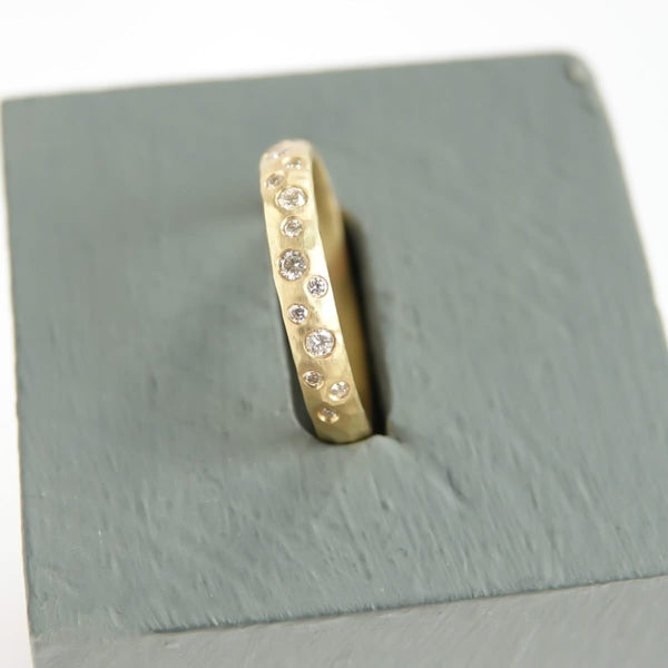 18ct gold diamond eternity ring with a hammered textured Sue Lane contemporary bespoke handmade