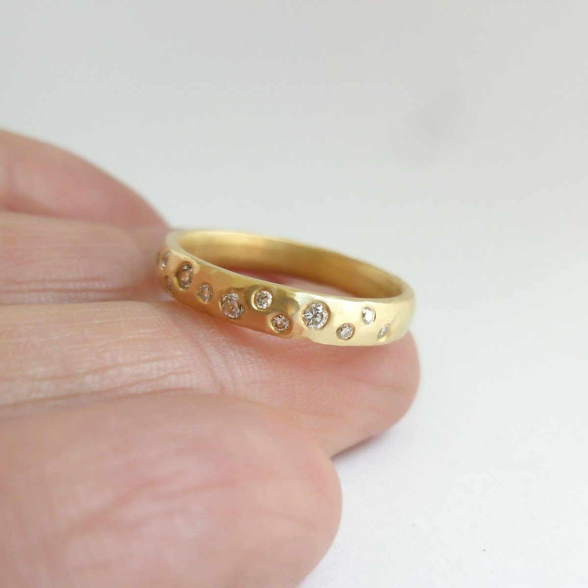18ct gold diamond eternity ring with a hammered textured Sue Lane contemporary bespoke handmade
