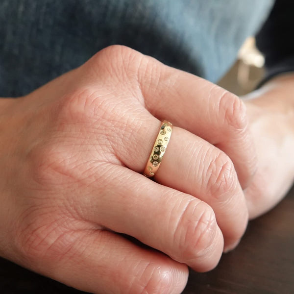 A modern, contemporary gold eternity ring, wedding ring, or engagement ring by Sue Lane