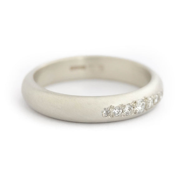 Profile view of the 4mm wide D-shaped white gold ring band with a modern matt finish.