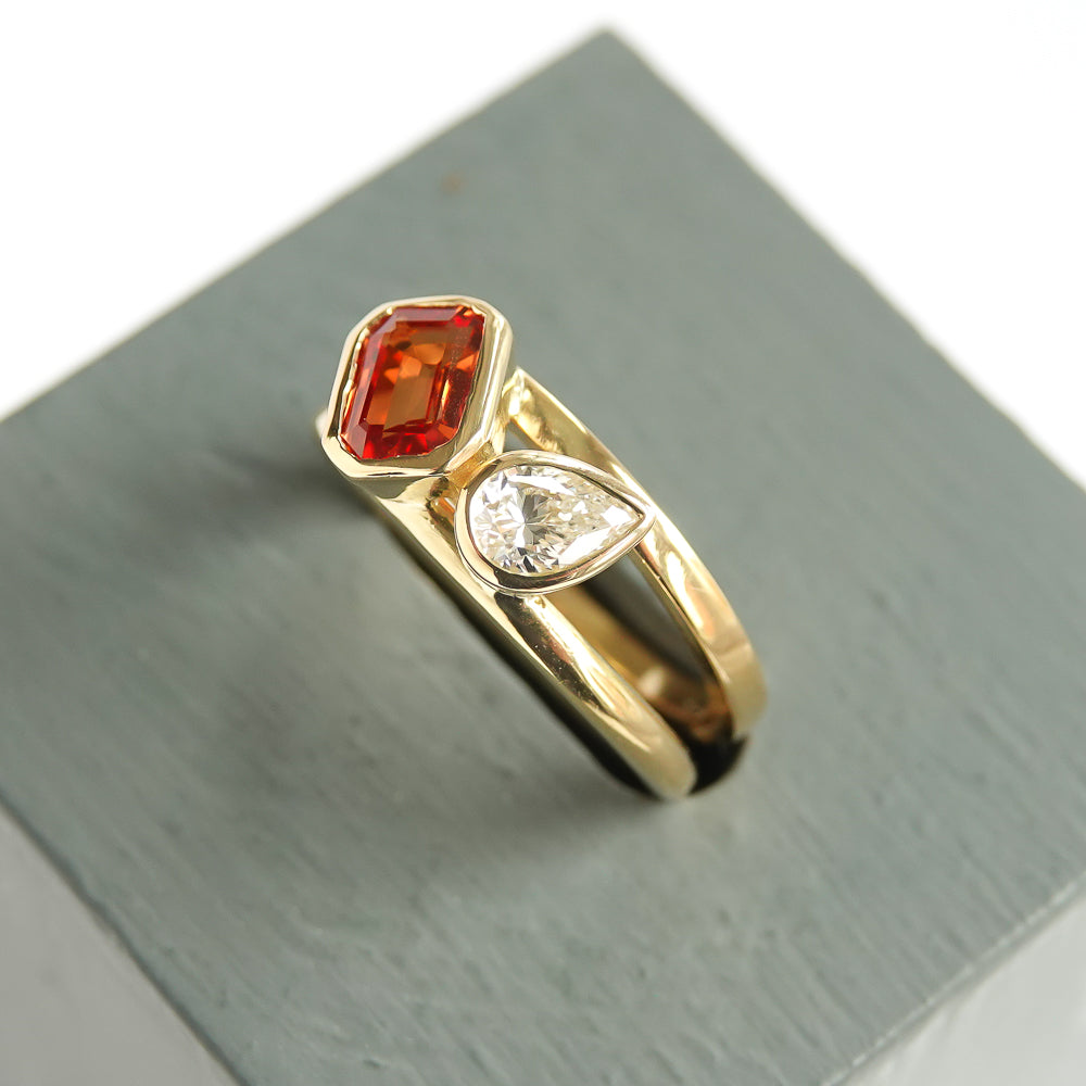 unique, bespoke, ethically sourced and conflict free orange sapphire and pear shaped diamond 18ct ring. Contemporary, bespoke, modern. It would be a fabulous alternative engagement ring or eternity ring.