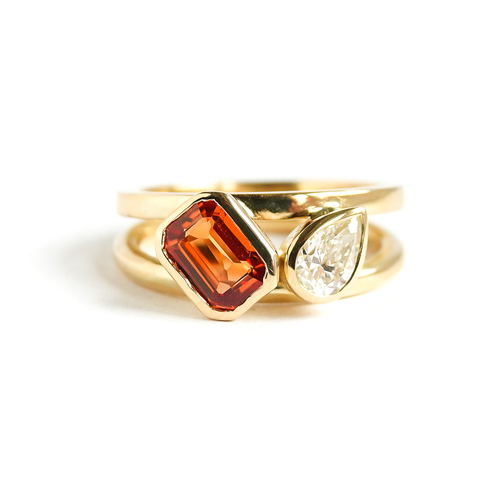 unique, bespoke, ethically sourced and conflict free orange sapphire and pear shaped diamond 18ct ring. Contemporary, bespoke, modern. It would be a fabulous alternative engagement ring or eternity ring.