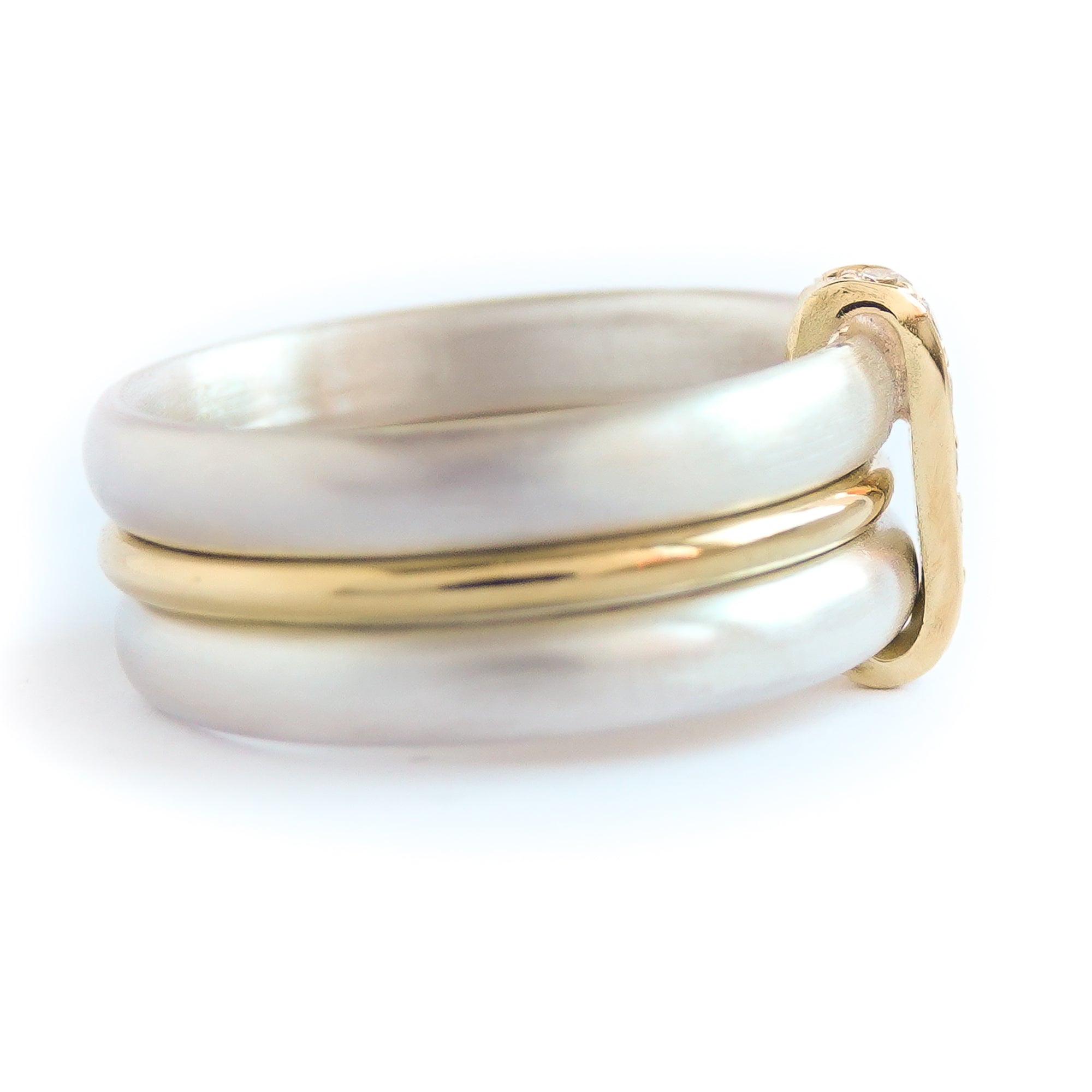 Contemporary treble band looped 18ct gold and diamond ring. Multi banded.