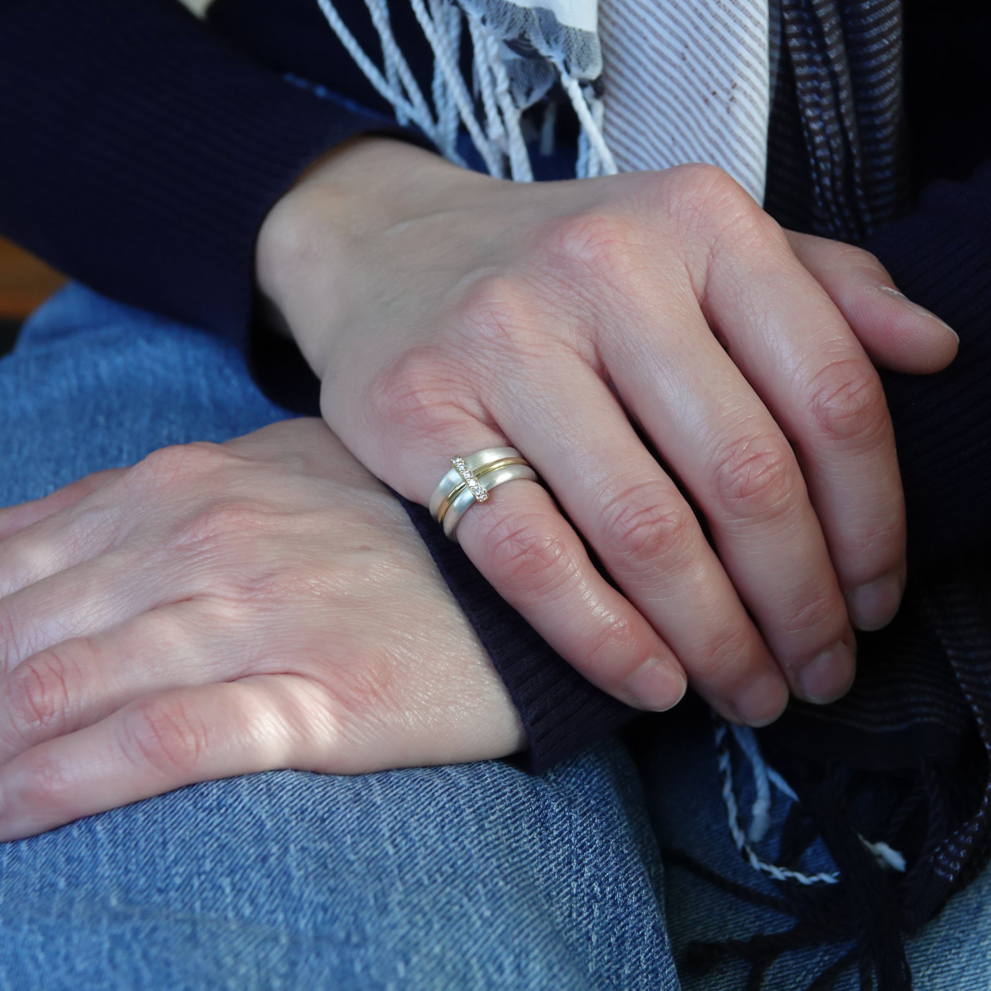 Contemporary treble band looped 18ct gold and diamond ring. Multi banded.