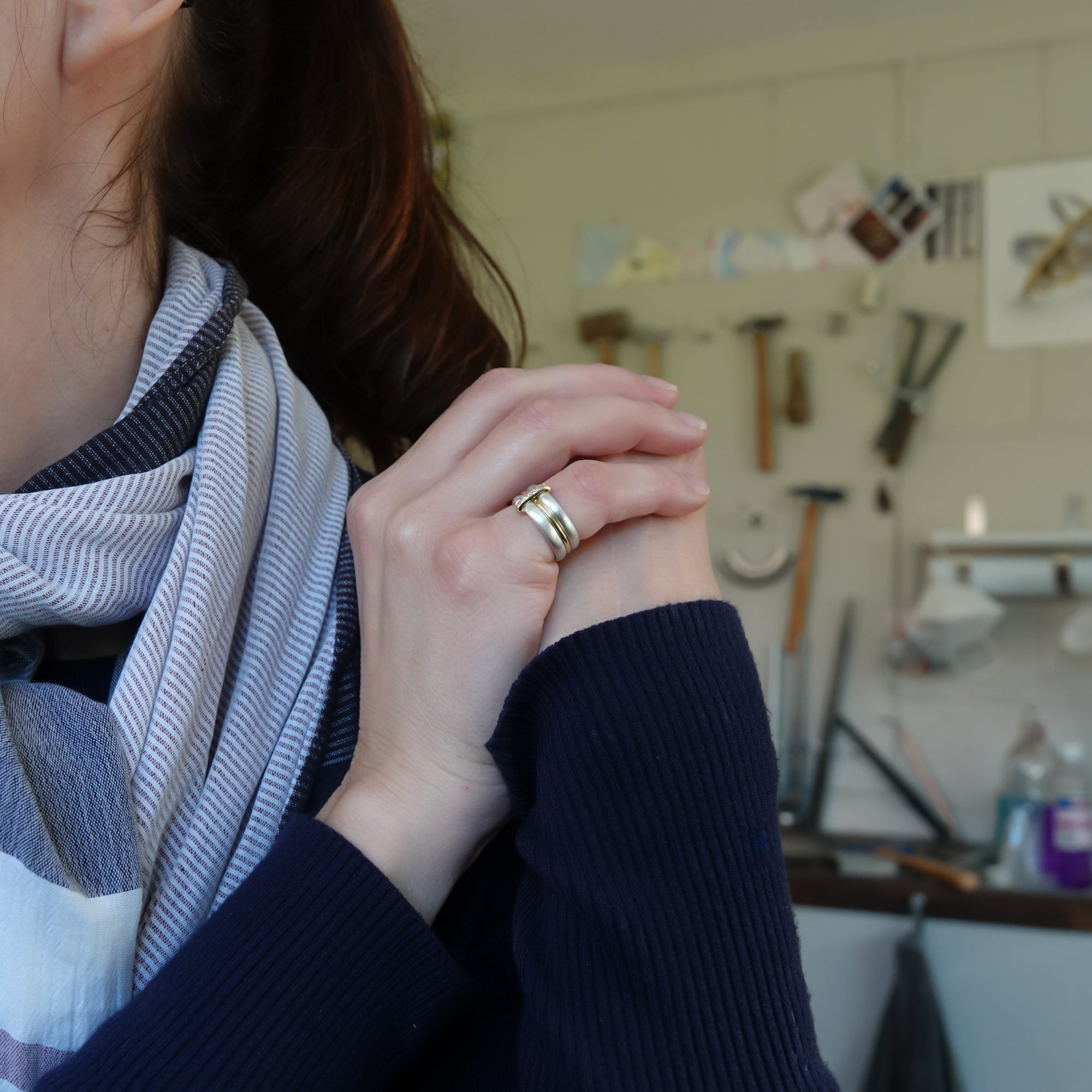 Contemporary treble band looped 18ct gold and diamond ring. Multi banded.