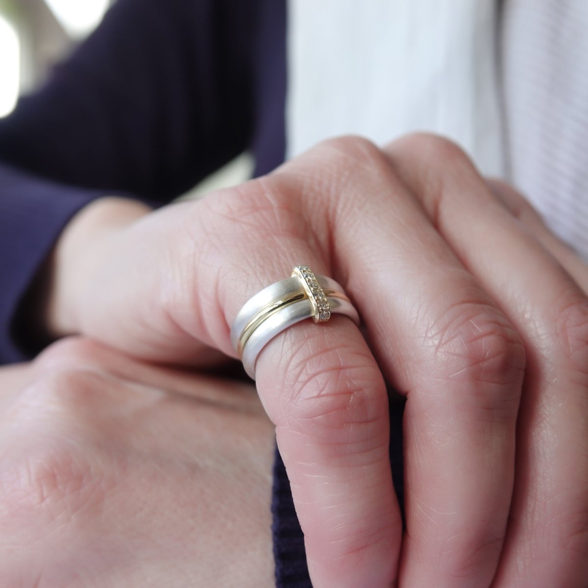 Silver, 18ct yellow gold and diamond triple band ring