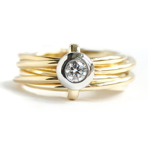 Contemporary, bespoke and modern yellow gold multi band engagement wedding ring, 0.25pt round white diamond, handmade by designer maker sue lane jewellery. Multi band ring or interlocking ring.