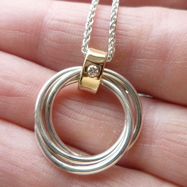 Handmade Russian ring pendant with three silver circles and 9ct gold loop with diamond detail