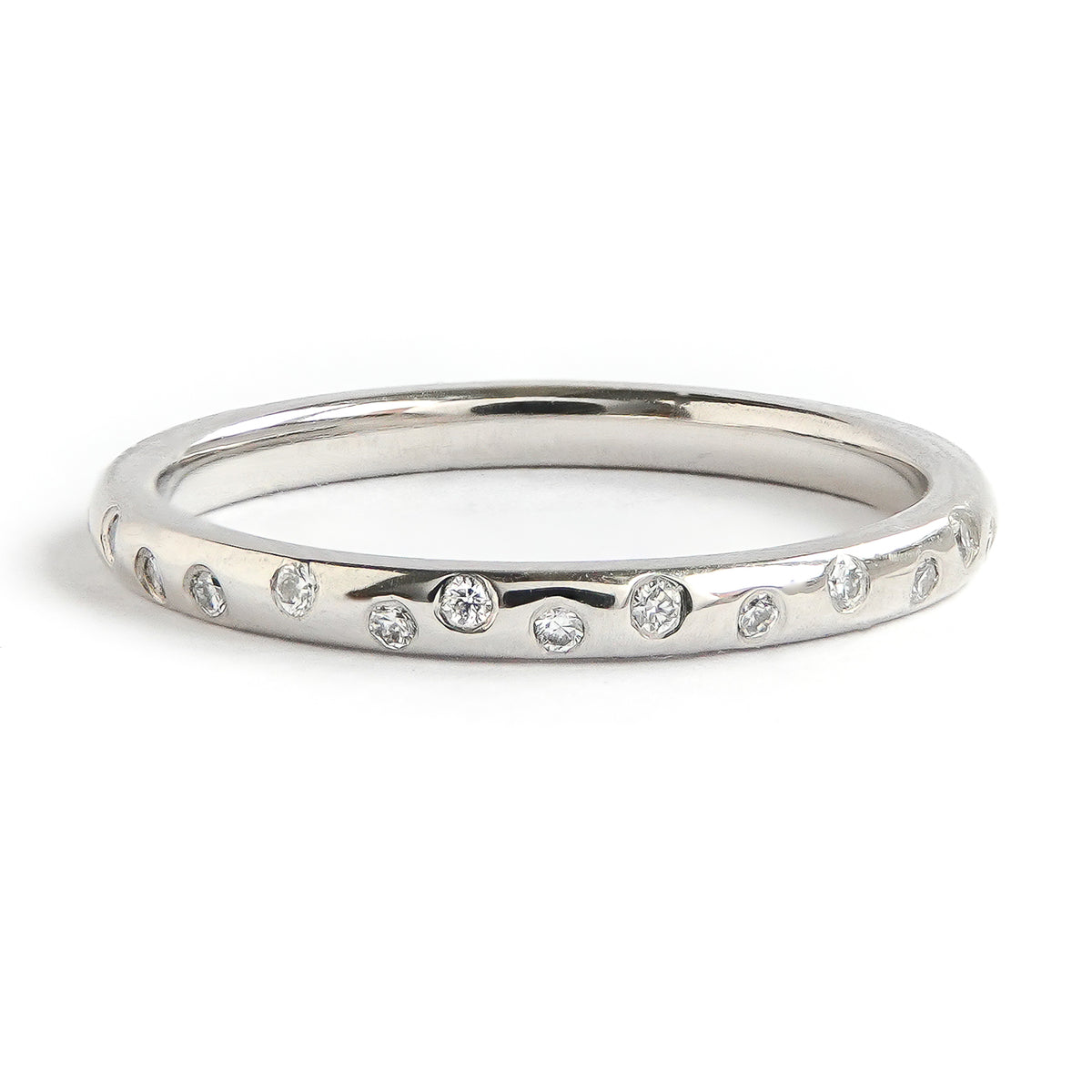 Contemporary, unique, bespoke and modern platinum diamond wedding ring, engagement ring, eternity ring, matt brushed finish. Handmade by designer maker Sue Lane