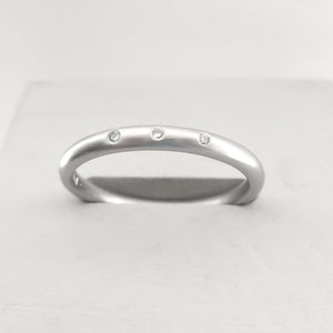 Simple elegant contemporary modern platinum and diamond wedding ring handmade by Sue Lane