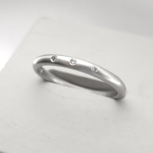 Simple elegant contemporary modern platinum and diamond wedding ring handmade by Sue Lane