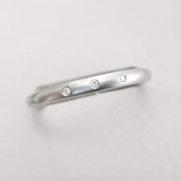 Simple elegant contemporary modern platinum and diamond wedding ring handmade by Sue Lane