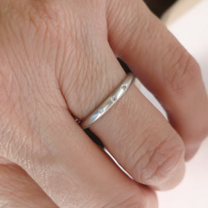 Simple elegant contemporary modern platinum and diamond wedding ring handmade by Sue Lane