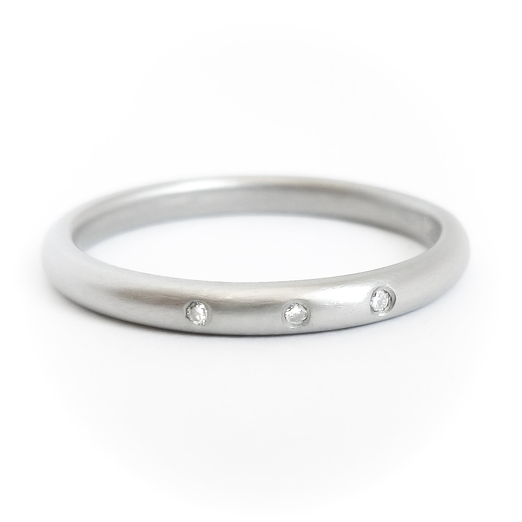 Simple elegant contemporary platinum and diamond wedding ring