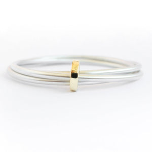 Unusual, unique, bespoke and modern silver and gold Russian style bangle with brushed finish. Handmade by Sue Lane Jewellery in Herefordshire, UK