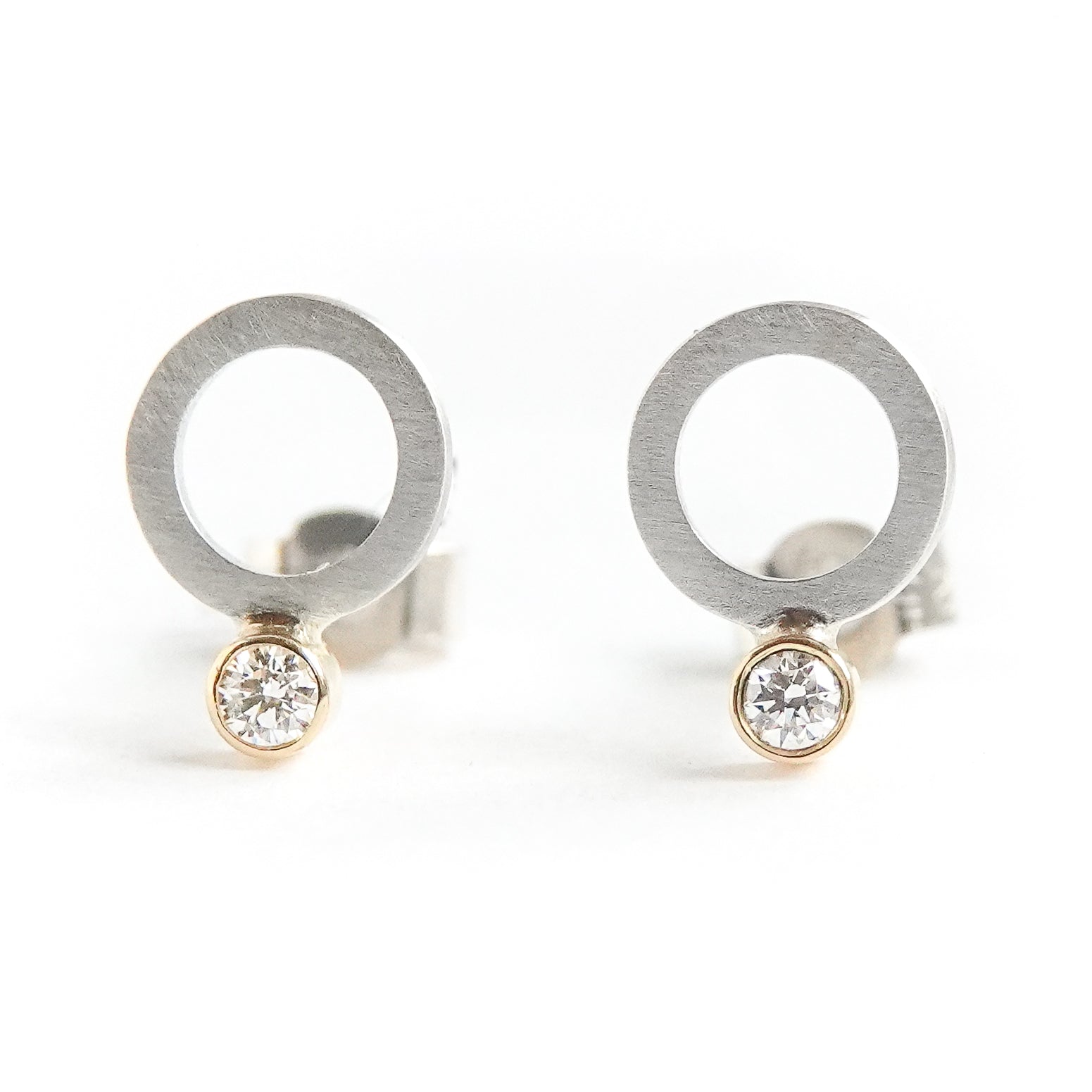 Contemporary, sparkling, silver, yellow gold and diamond stud earrings by Sue Lane