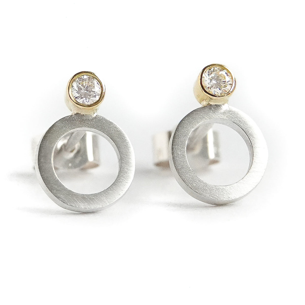 Contemporary, sparkling, silver, yellow gold and diamond stud earrings by Sue Lane