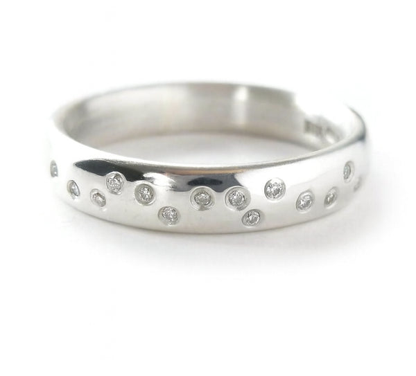 Polished silver handmade designer ring with embedded diamonds