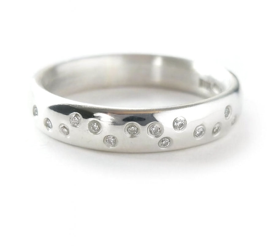 Polished silver handmade designer ring with embedded diamonds