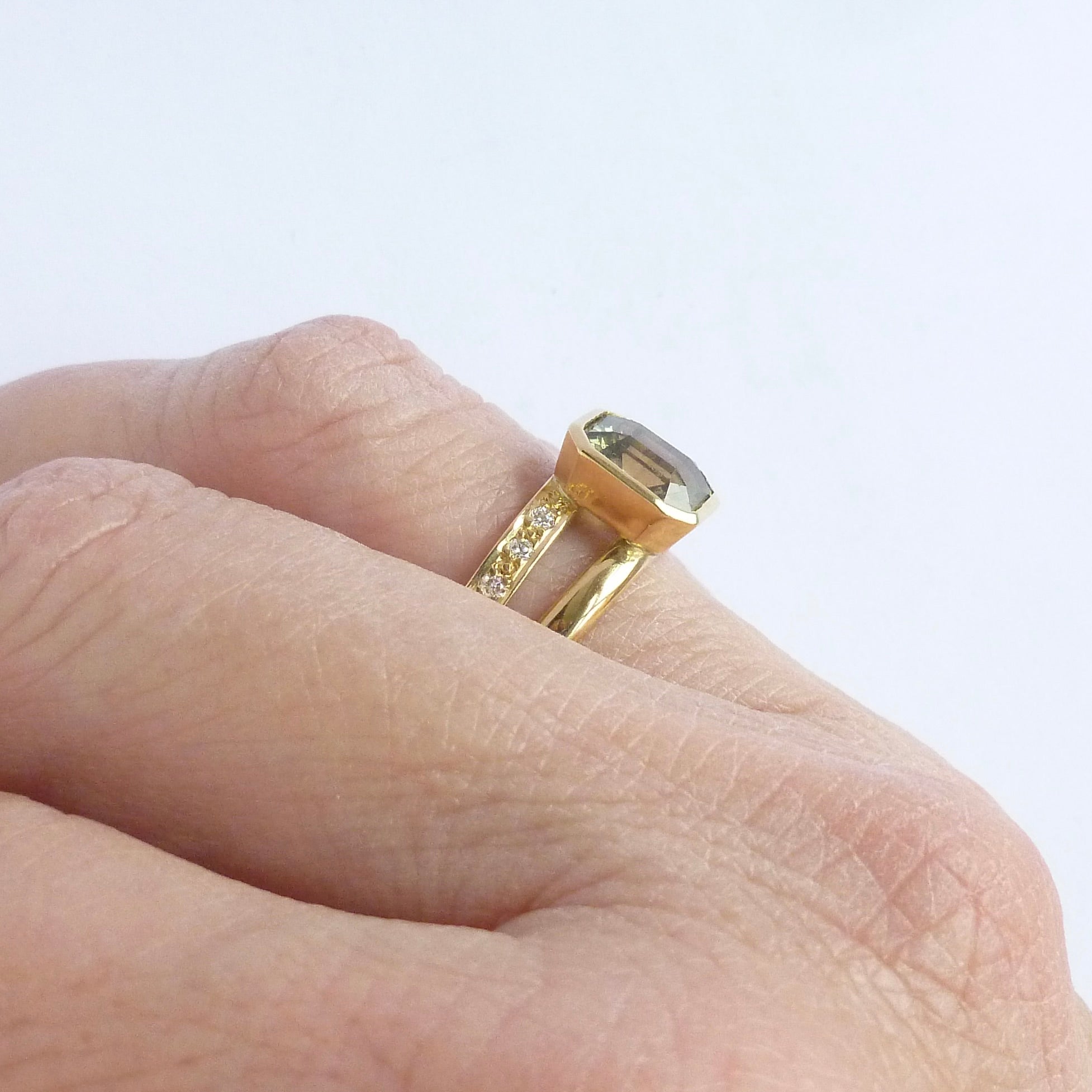 Contemporary artisan gold ring with octagonal sapphire