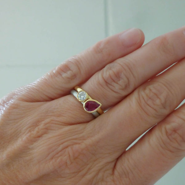 Engagement ring luxury style featuring a vibrant ruby set in a bespoke platinum band.