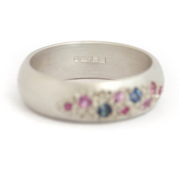 Modern silver dress ring set with pink and blue sapphires, handmade by Sue Lane Jewellery in the UK