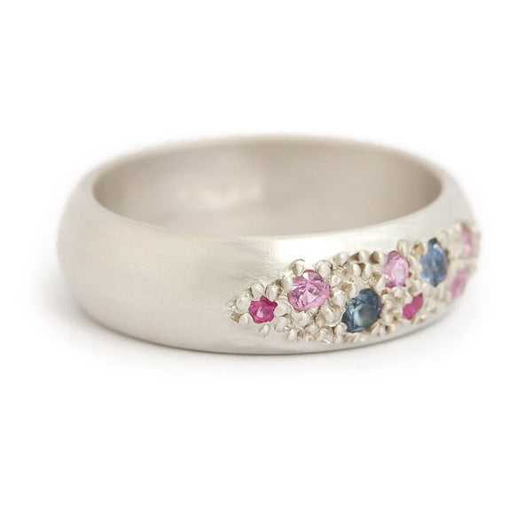 Modern silver dress ring set with pink and blue sapphires, handmade by Sue Lane Jewellery in the UK