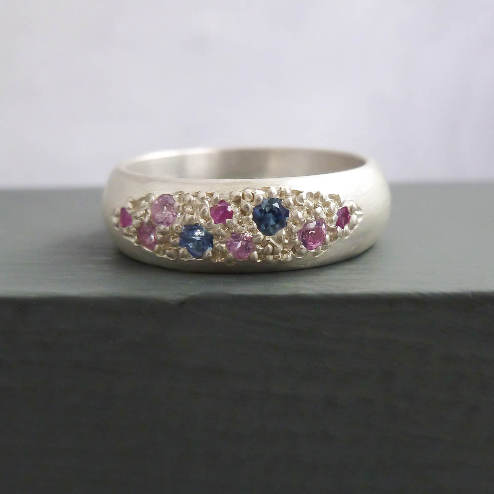 Modern silver dress ring set with pink and blue sapphires, handmade by Sue Lane Jewellery in the UK