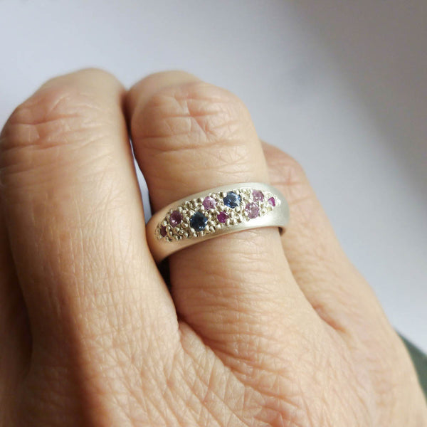 Modern silver dress ring set with pink and blue sapphires, handmade by Sue Lane Jewellery in the UK