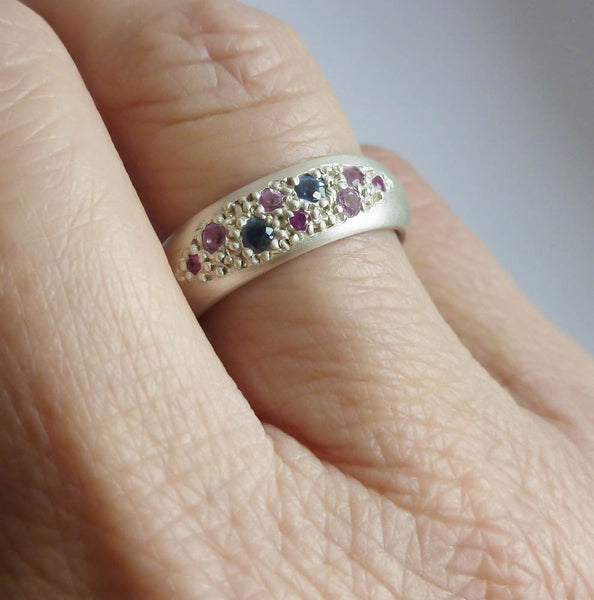 Modern silver dress ring set with pink and blue sapphires, handmade by Sue Lane Jewellery in the UK