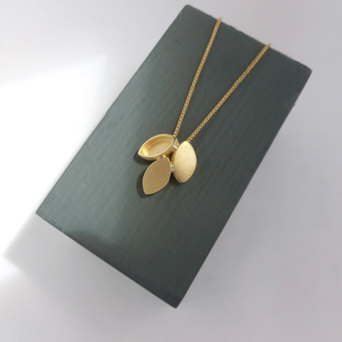 Modern and simple yellow gold leaf contemporary necklace handmade by Sue Lane UK