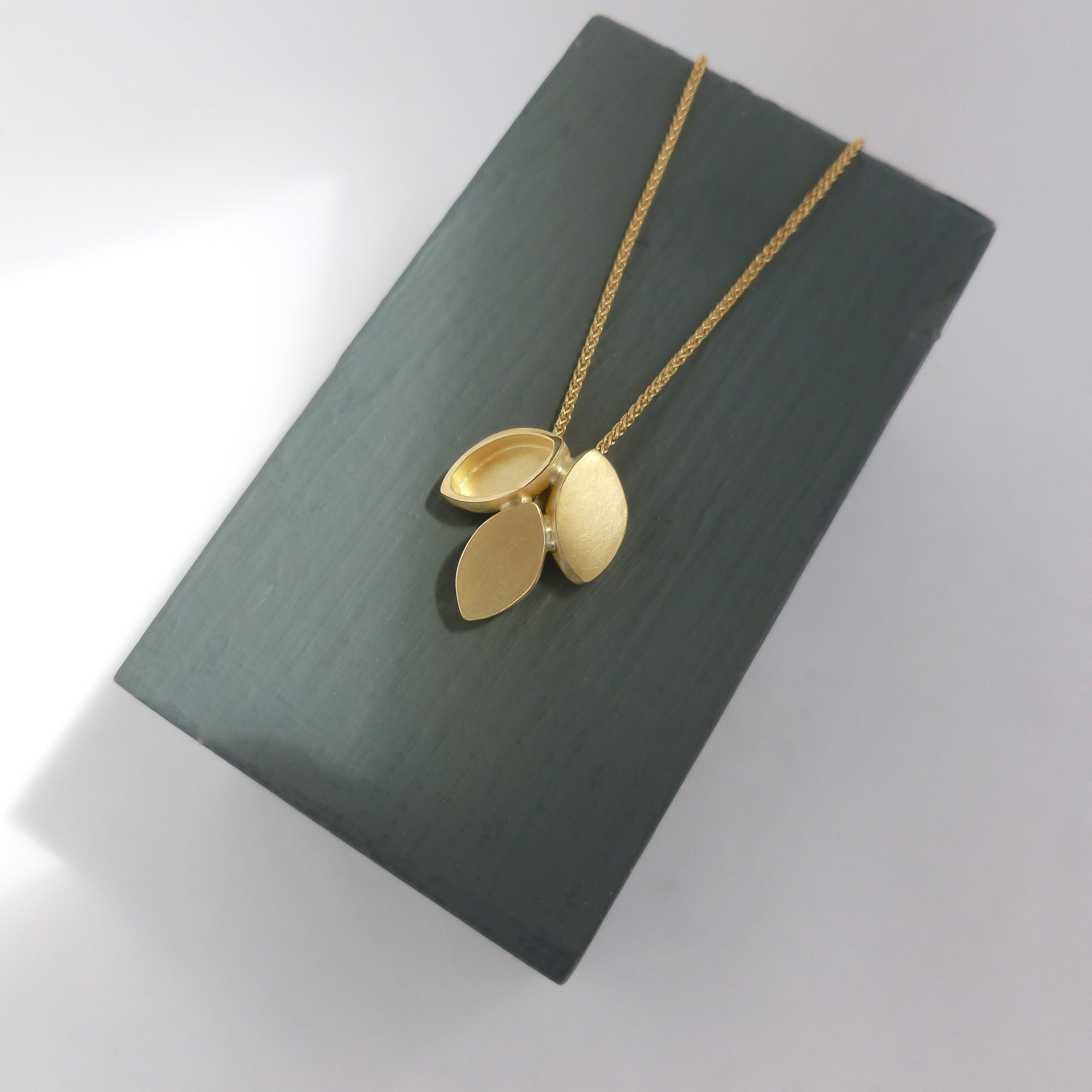 Modern and simple yellow gold leaf contemporary necklace handmade by Sue Lane UK