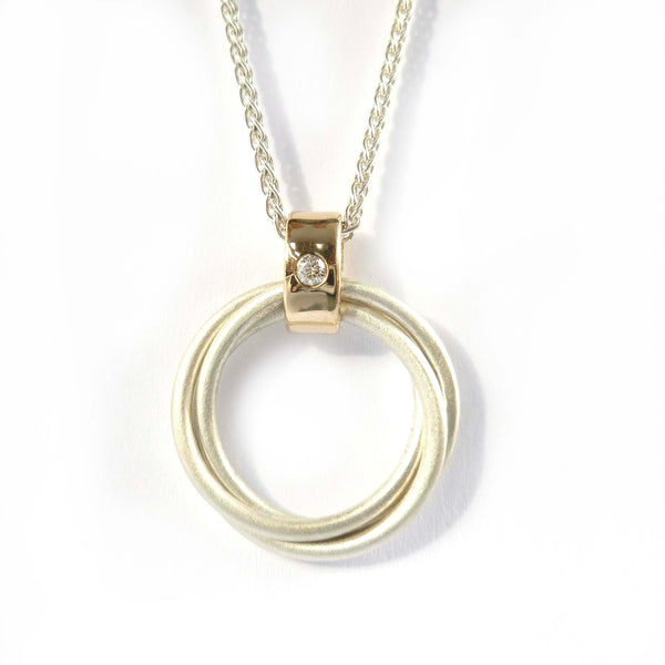 Handmade Russian ring pendant with three silver circles and 9ct gold loop with diamond detail