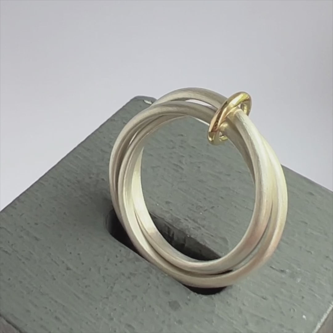 Unusual, unique, bespoke and modern silver "Russian Wedding ring" playful and tactile with brushed finish. Handmade by Sue Lane Contemporary Jewellery UK. 