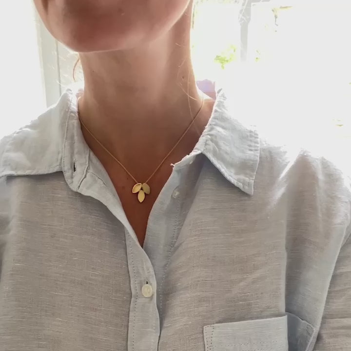 Modern and simple yellow gold leaf contemporary necklace handmade by Sue Lane UK