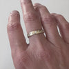 A modern unique eternity ring with 20 diamonds. Beautiful contemporary wedding, eternity or engagement ring.