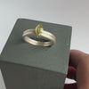 A contemporary silver, 18ct gold and peridot ring handmade by Sue Lane