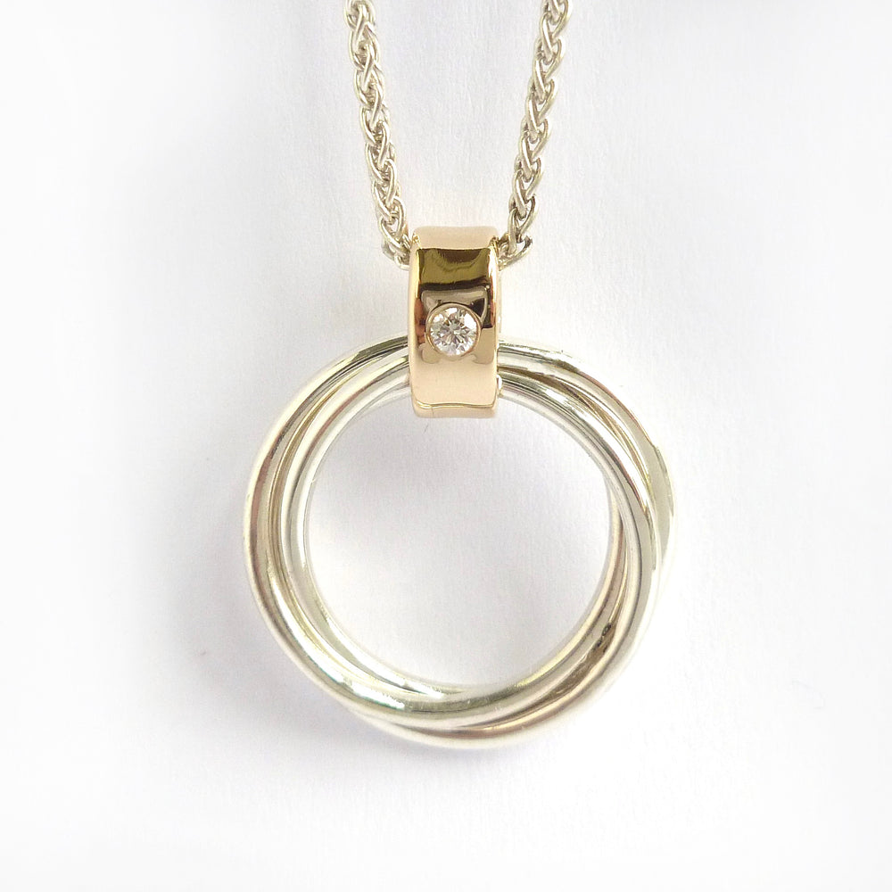 Contemporary Russian ring necklace in sterling silver with 9ct gold loop and flush set diamond by Sue Lane